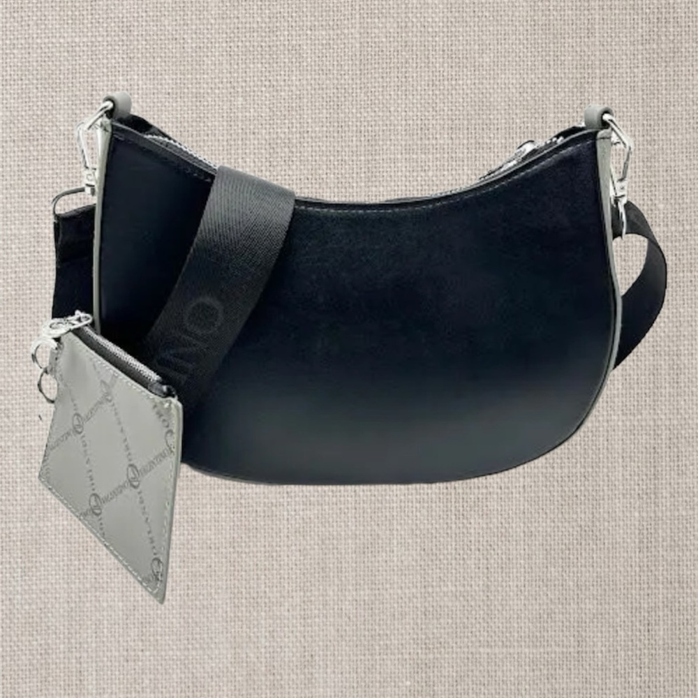 Crescent shape Crossbody with Webstrap and Additional
Wallet. Vegan leather